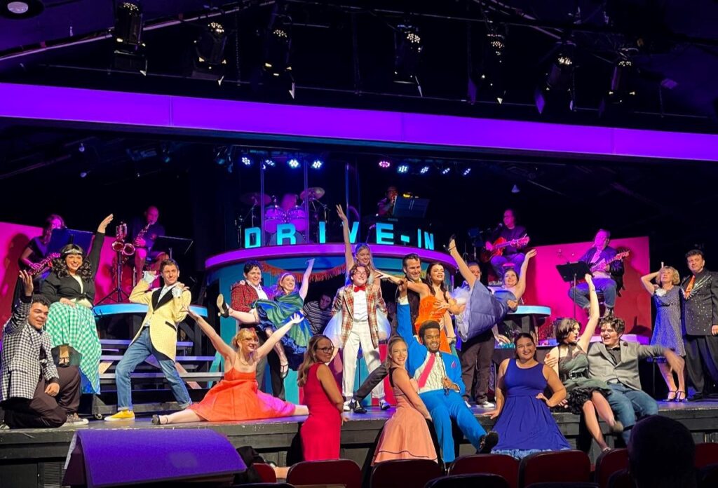 An ensemble cast poses on stage for a production of Grease at the Barn Theatre, Stuart Florida