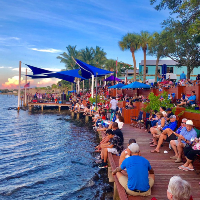 people crowded around a dock