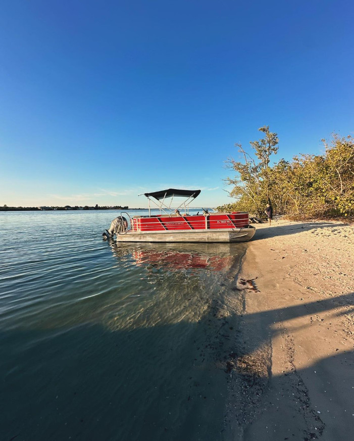 pontoon boat by beach